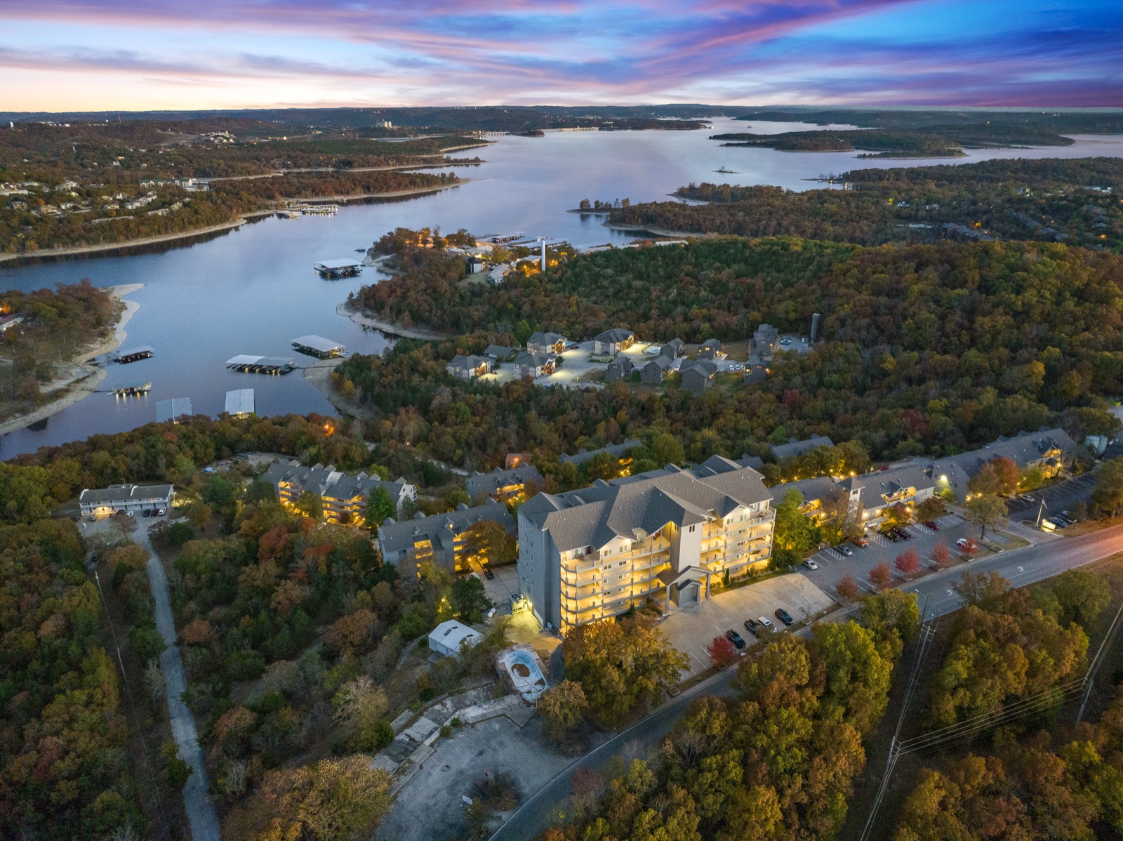 Aerial drone view of Branson lakefront property at sunset
